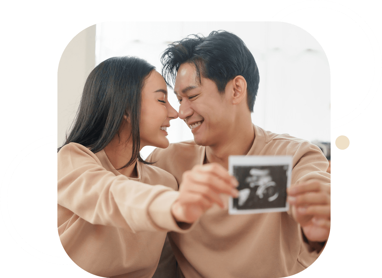 Expectant parents sharing a joyful moment