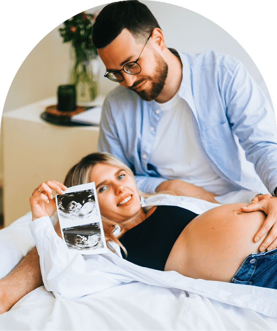 Couple celebrating pregnancy with ultrasound